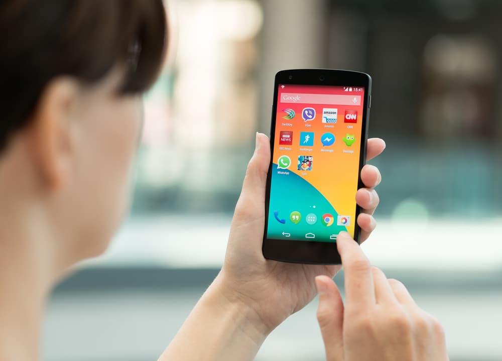woman using an android phone