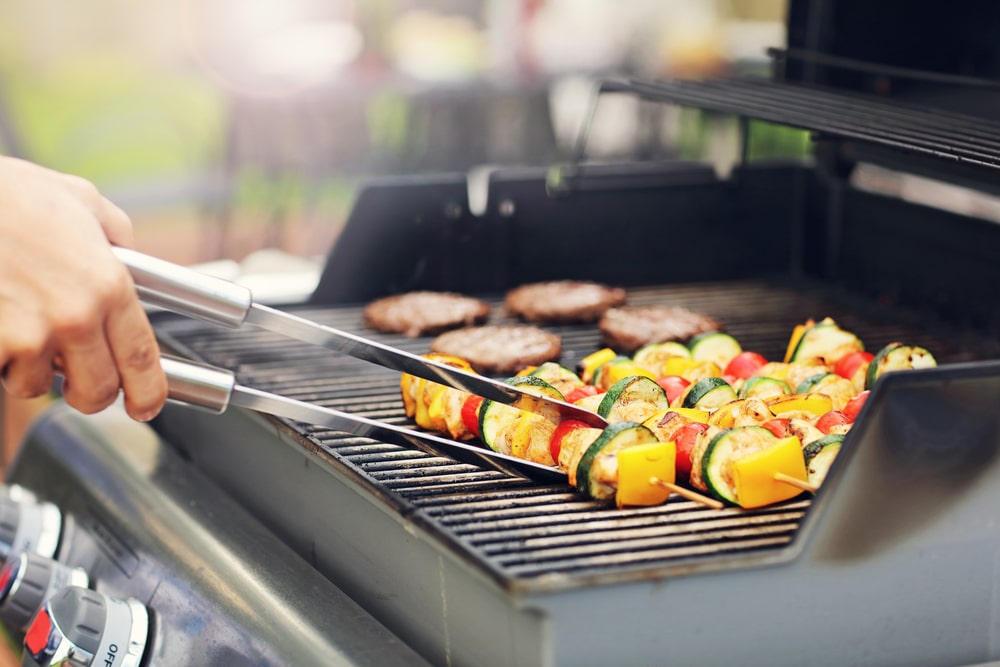 man grilling on gas grill